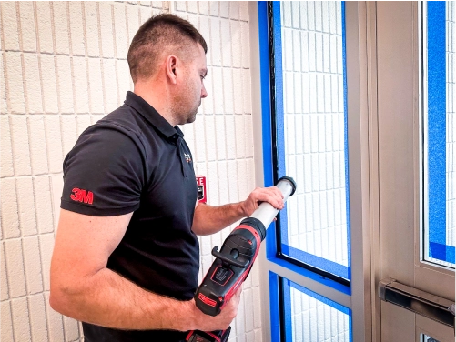 Glass held together by 3M Safety and Security Window Film after impact